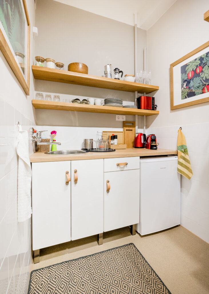 Apartment Hugo kitchen comes with a microwave, a toaster and a fridge, as well as coffee machine.
