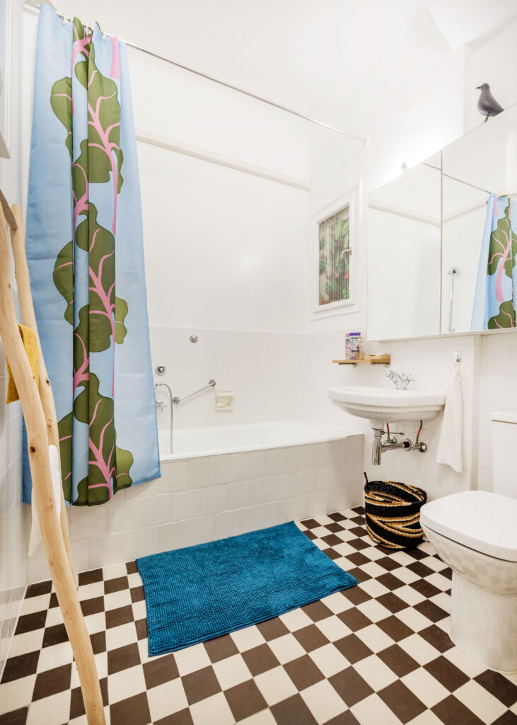 1 bathroom with a bath and a shower.