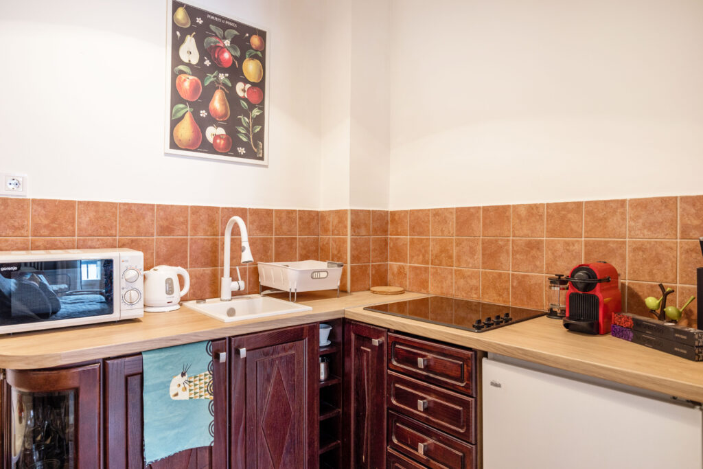 fully equipped kitchen with a microwave and a fridge